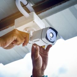 Technician,Installing,Cctv,Camera,Security,System,At,Car,Park,And